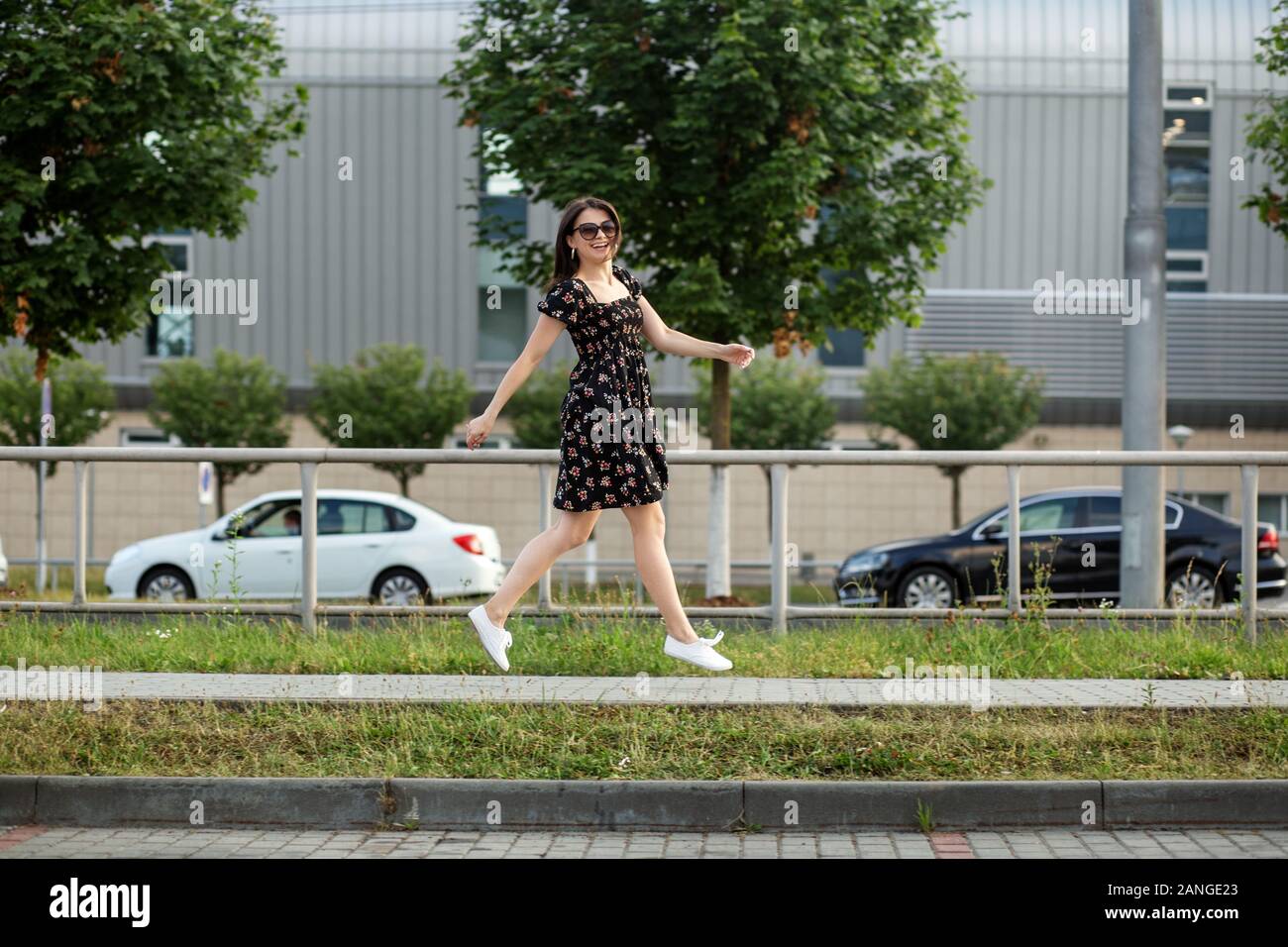 Woman running dress street hi-res stock photography and images - Alamy