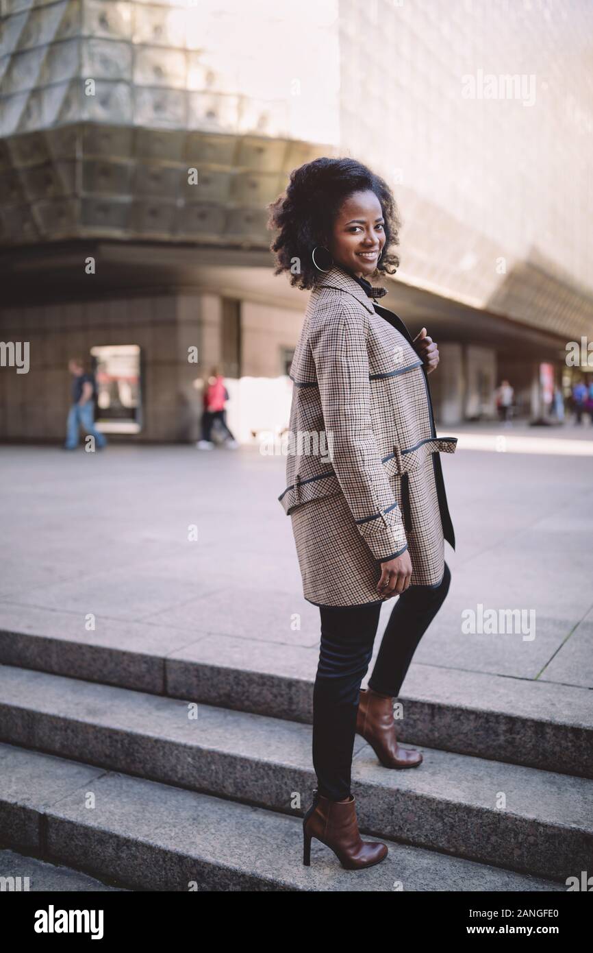 Beautiful african american young woman with afro and large hoop ...