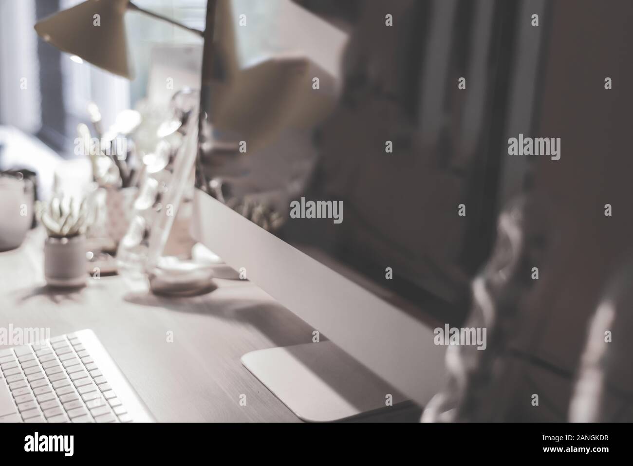 Blurred Large Computer Screen On A Home Office Desk Interior Eith