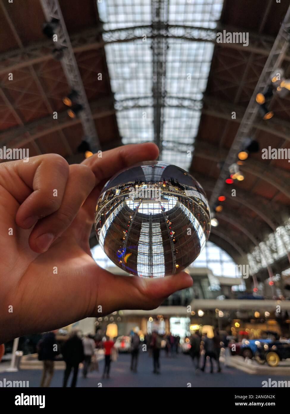 AUTOWORLD MUSEUM, BRUSSELS, January 2019, Man holding Lensball in hand at Autoworld museum Stock Photo