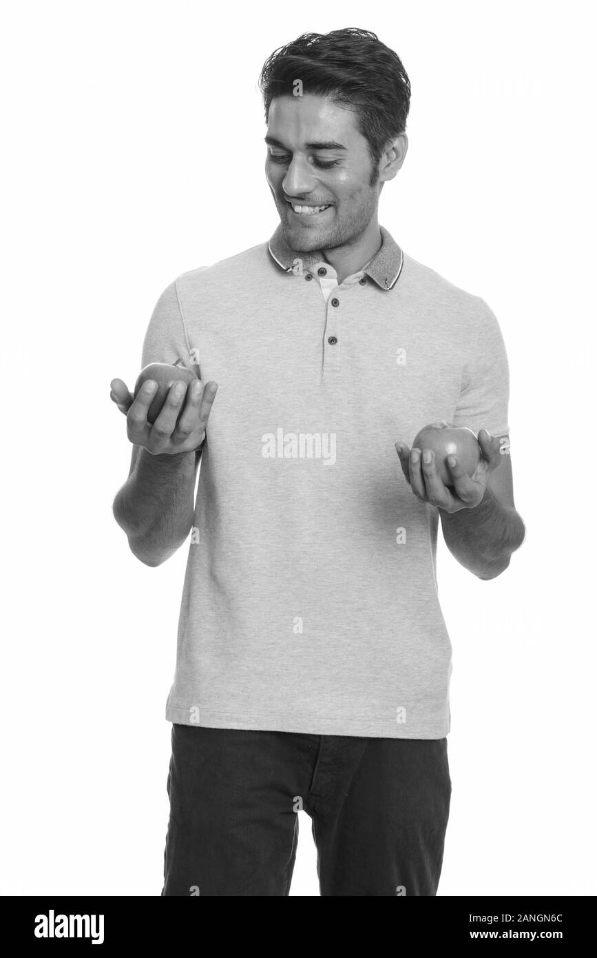 Young man holding red apple Black and White Stock Photos & Images - Alamy