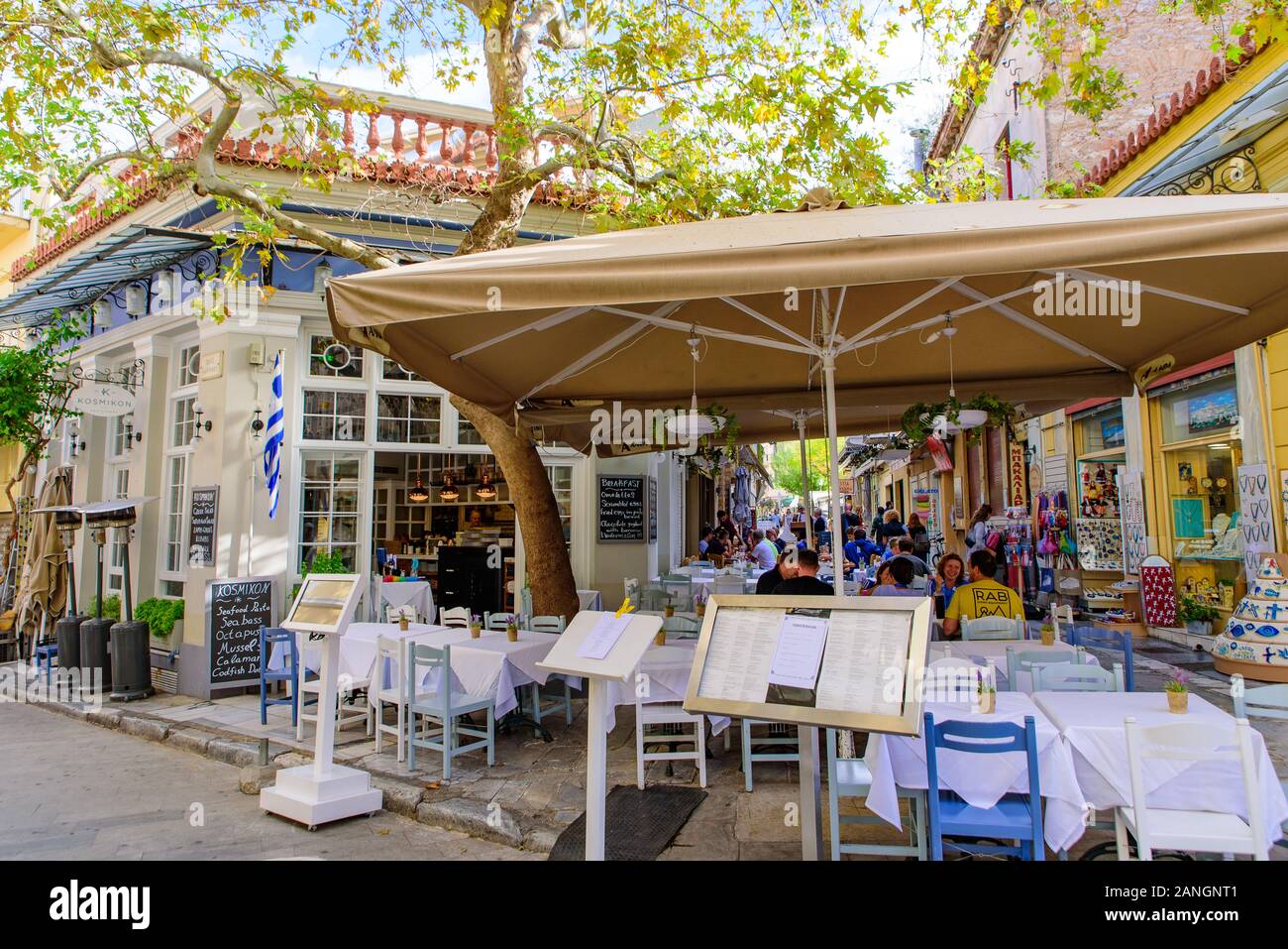 Outdoor seats of restaurant on the street in Athens, Greece Stock Photo
