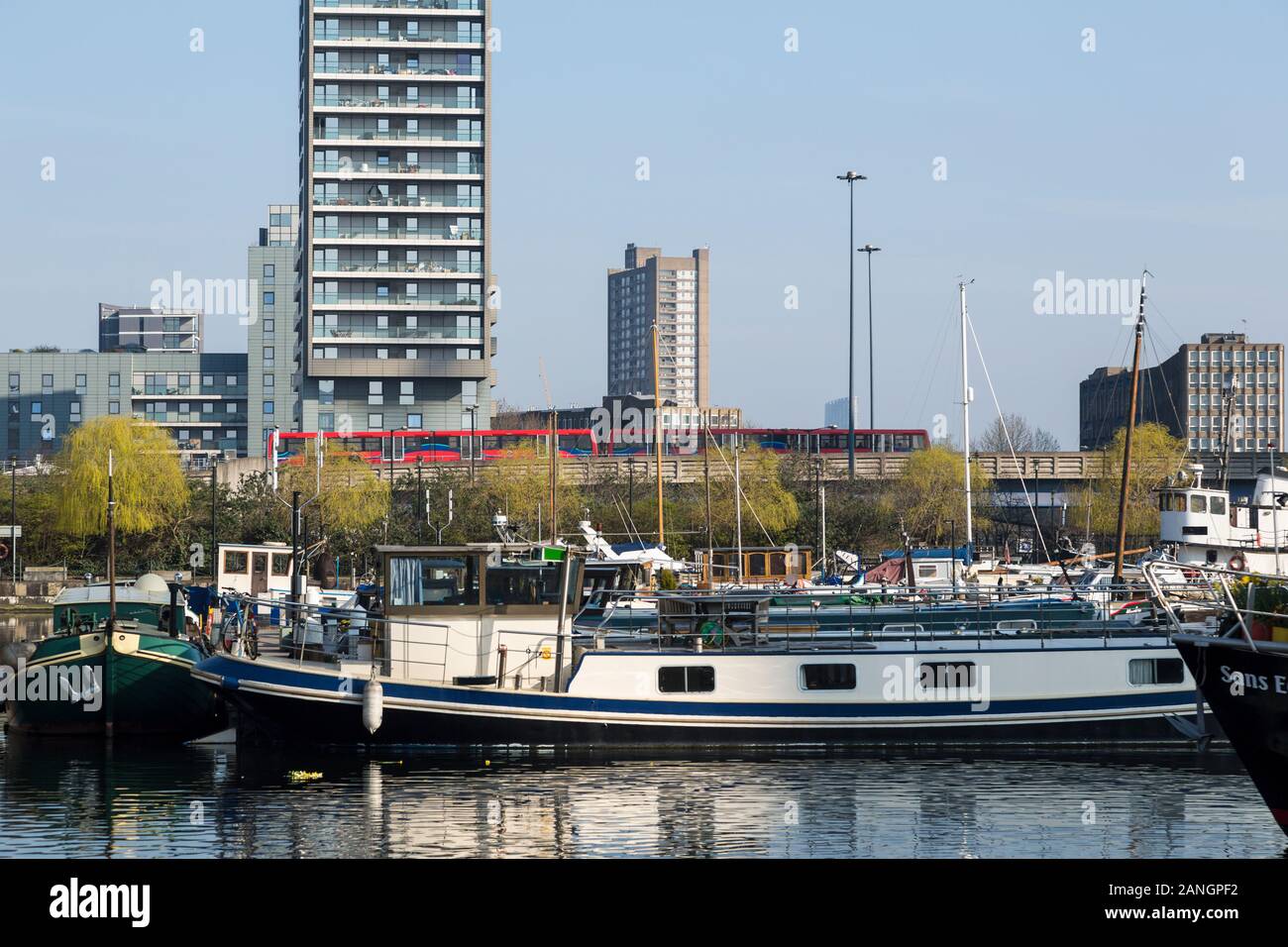 Docklands Light Railway passes dockland area, London, England Stock Photo