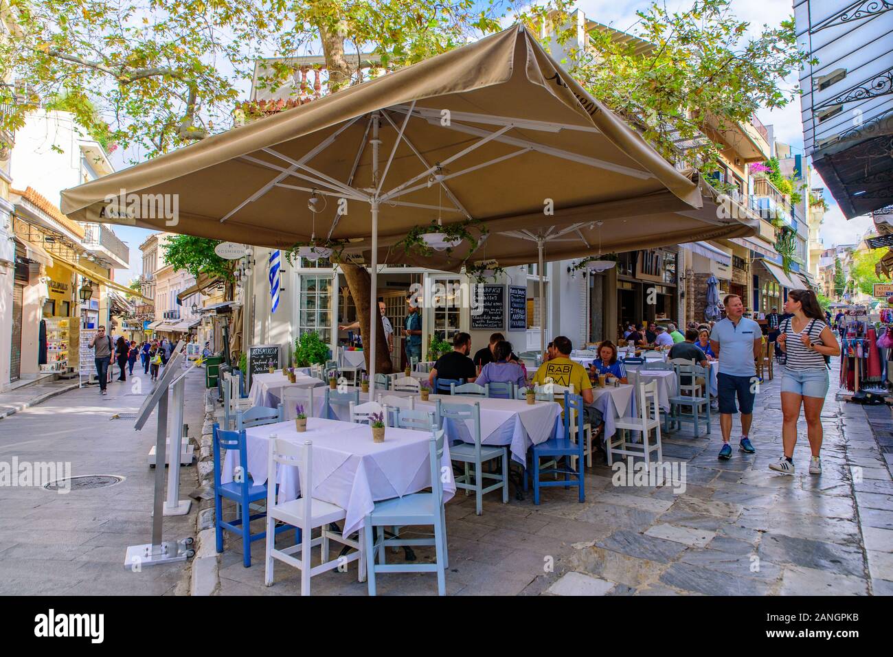 Outdoor seats of restaurant on the street in Athens, Greece Stock Photo