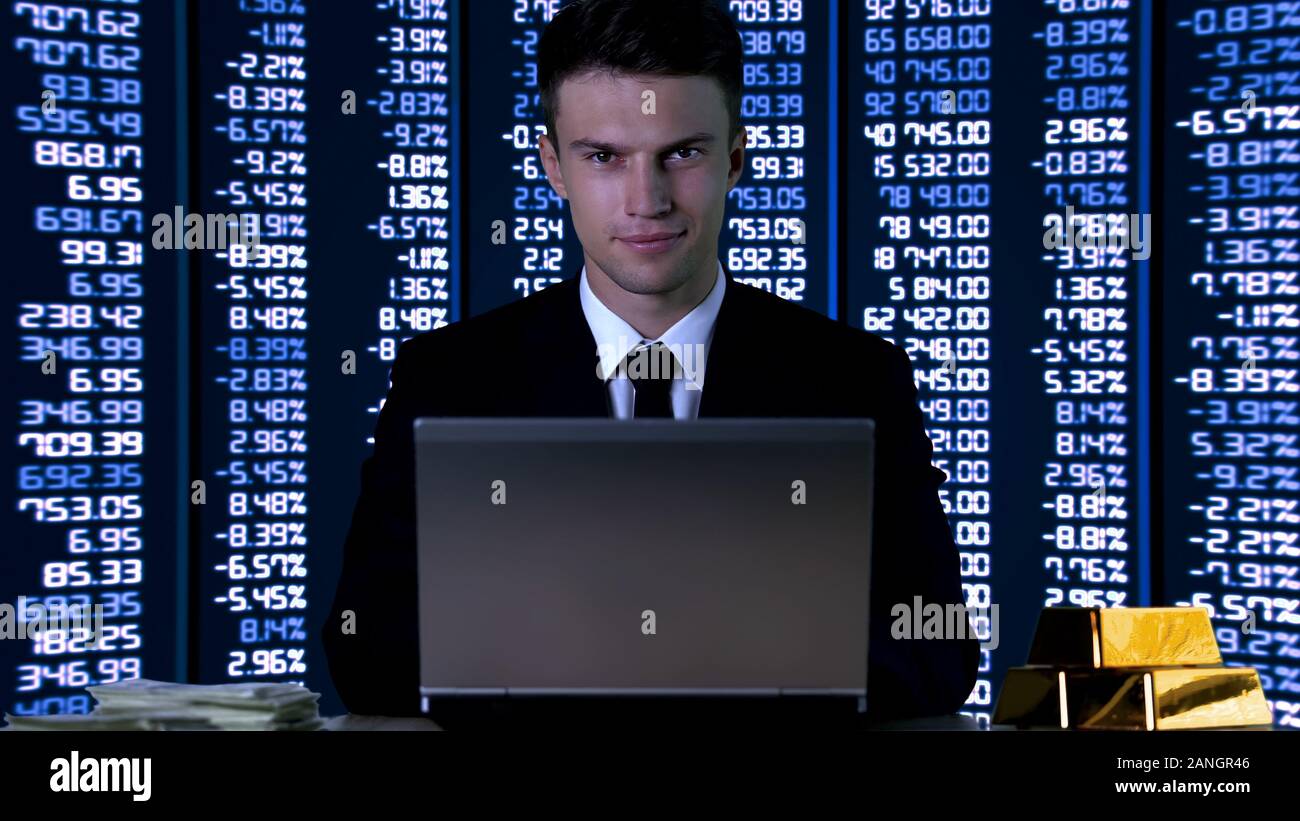 Rich businessman smiling on codes and numbers background, stock exchange profit Stock Photo