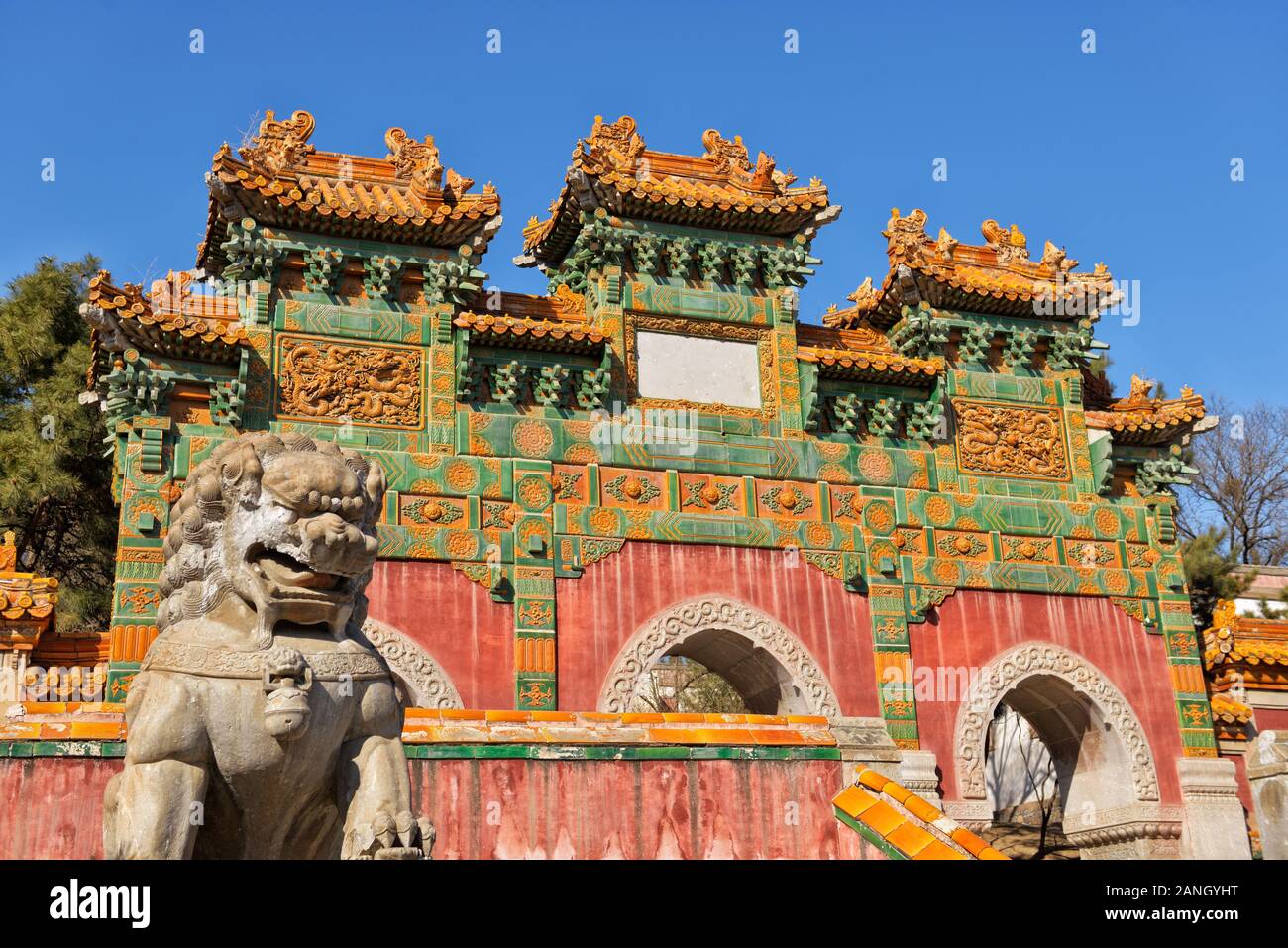 Dragon lion guard in front of Gate with three arches in park of Putuo Zongcheng temple in China close to Chengde city in Hebei province. Stock Photo