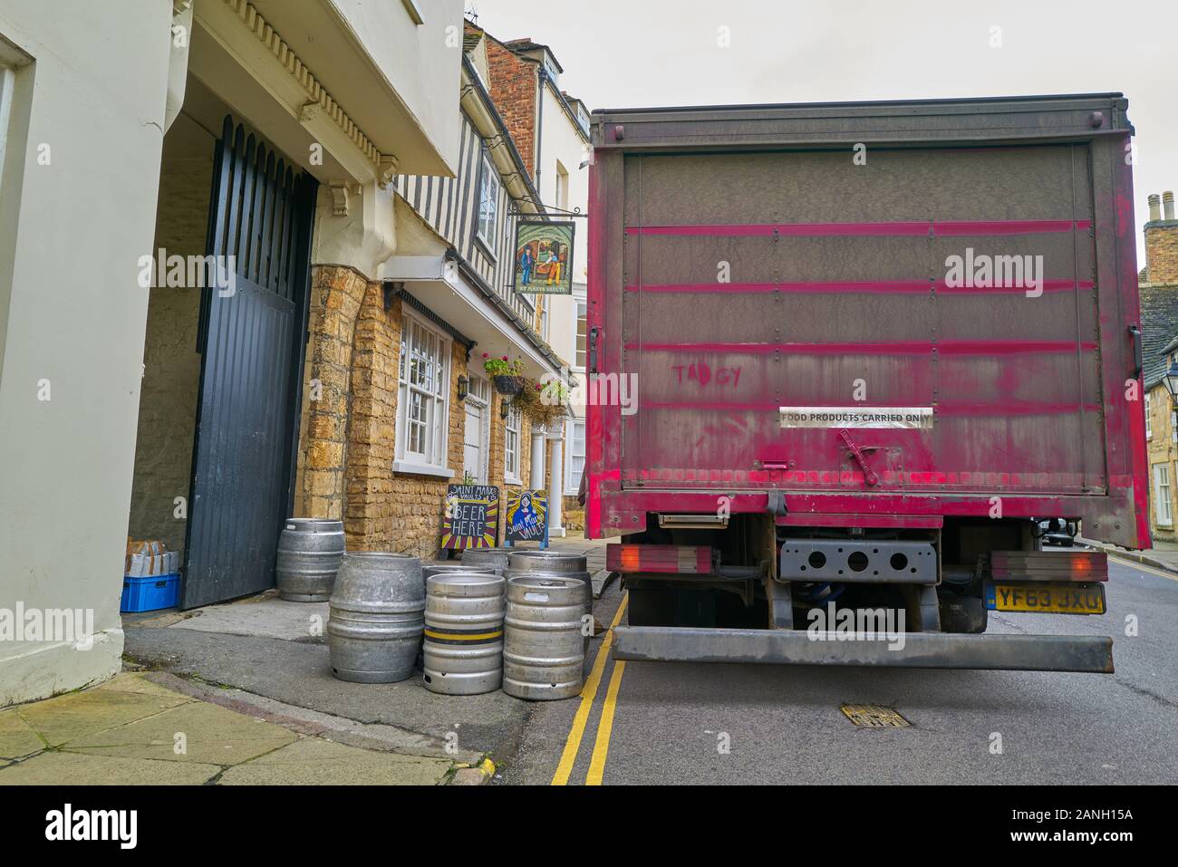 Lorry delivery of kegs of beer to the pub named St Mary’s Vaults in the town of Stamford, Lincolnshire, England. Stock Photo