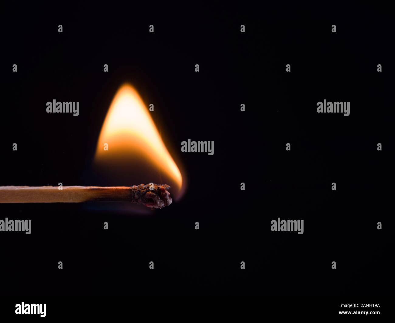 burning match on black background Stock Photo