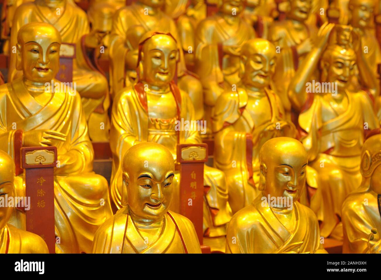 Gold buddhist statue in Longhua temple. Statues of the 500 Lohan Stock