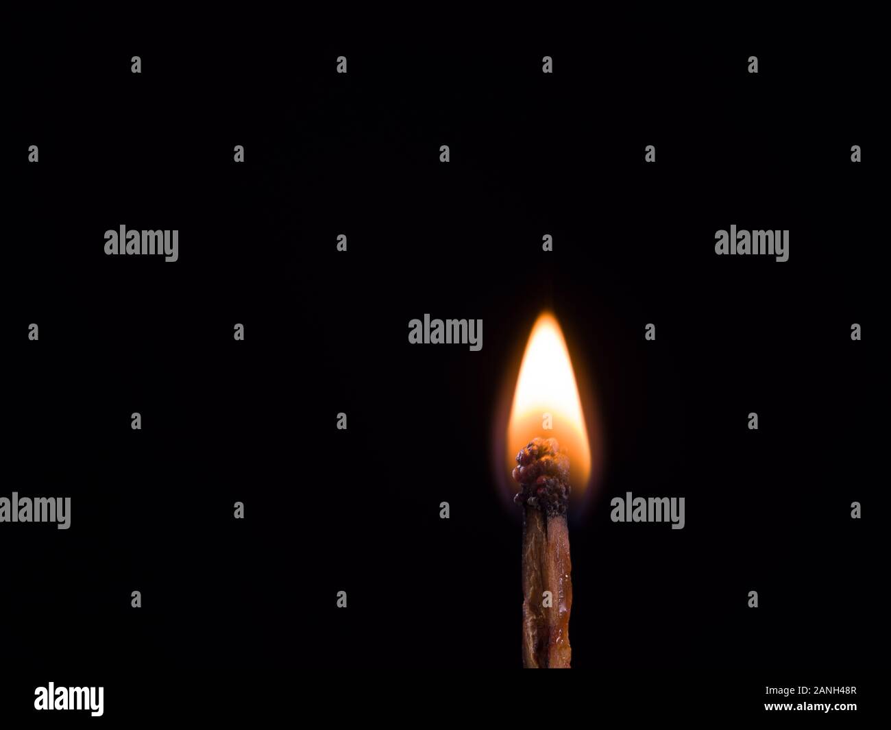 burning match on black background Stock Photo