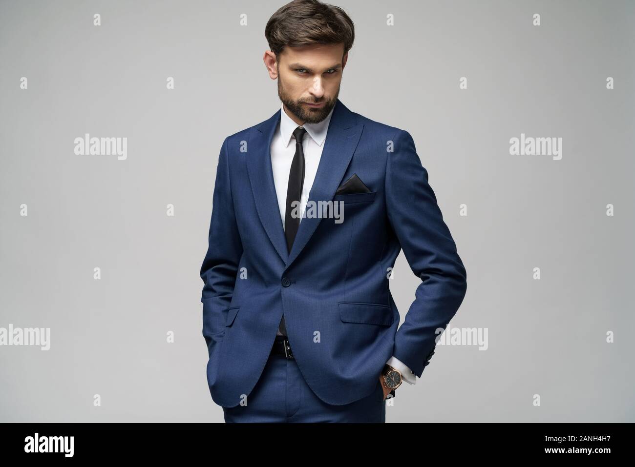 studio photo of young handsome businessman wearing suit Stock Photo - Alamy