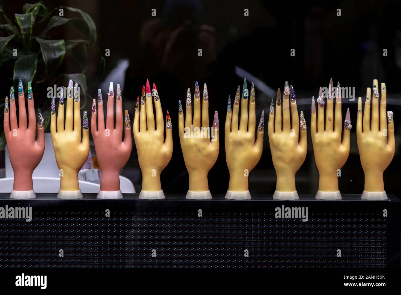 strange plastic hands advertising nail salon Stock Photo