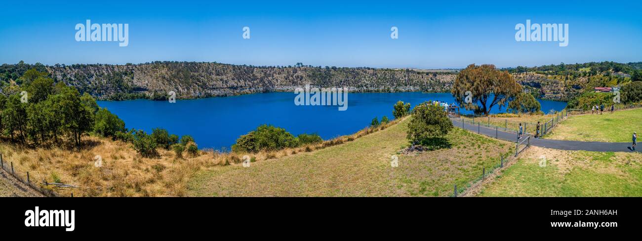 Tourists on viewing platform at the Blue Lake in Mount Gambier, South Australia - wide aerial panorama Stock Photo