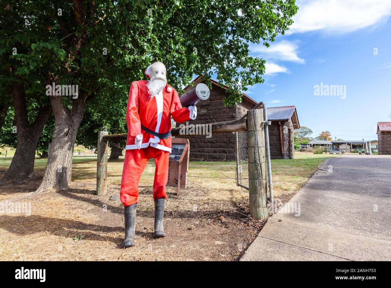 Large Santa Claus doll holding mailbox in Australian outback Stock Photo