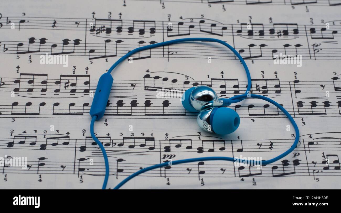 musical notation with earphones forming a heart Stock Photo