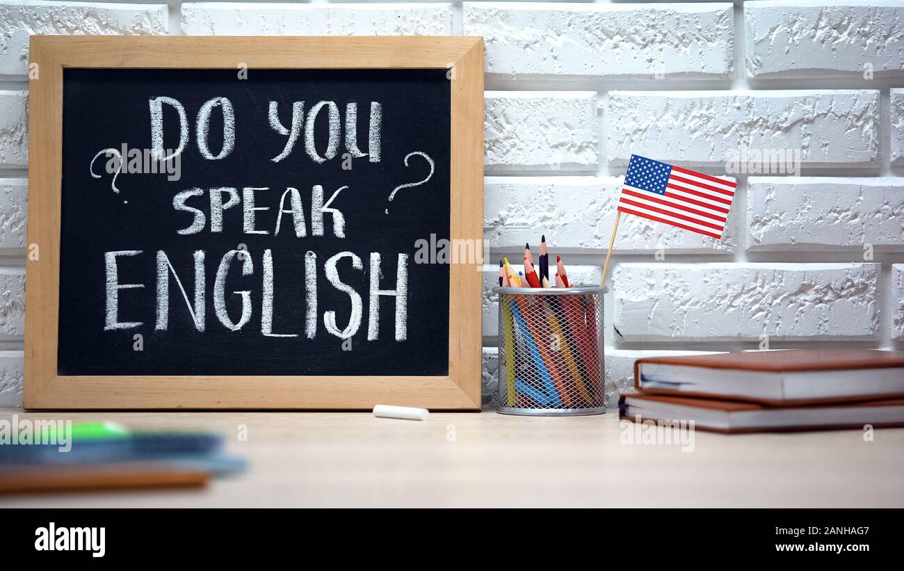 Do you speak English written on board, international flag in box, language Stock Photo