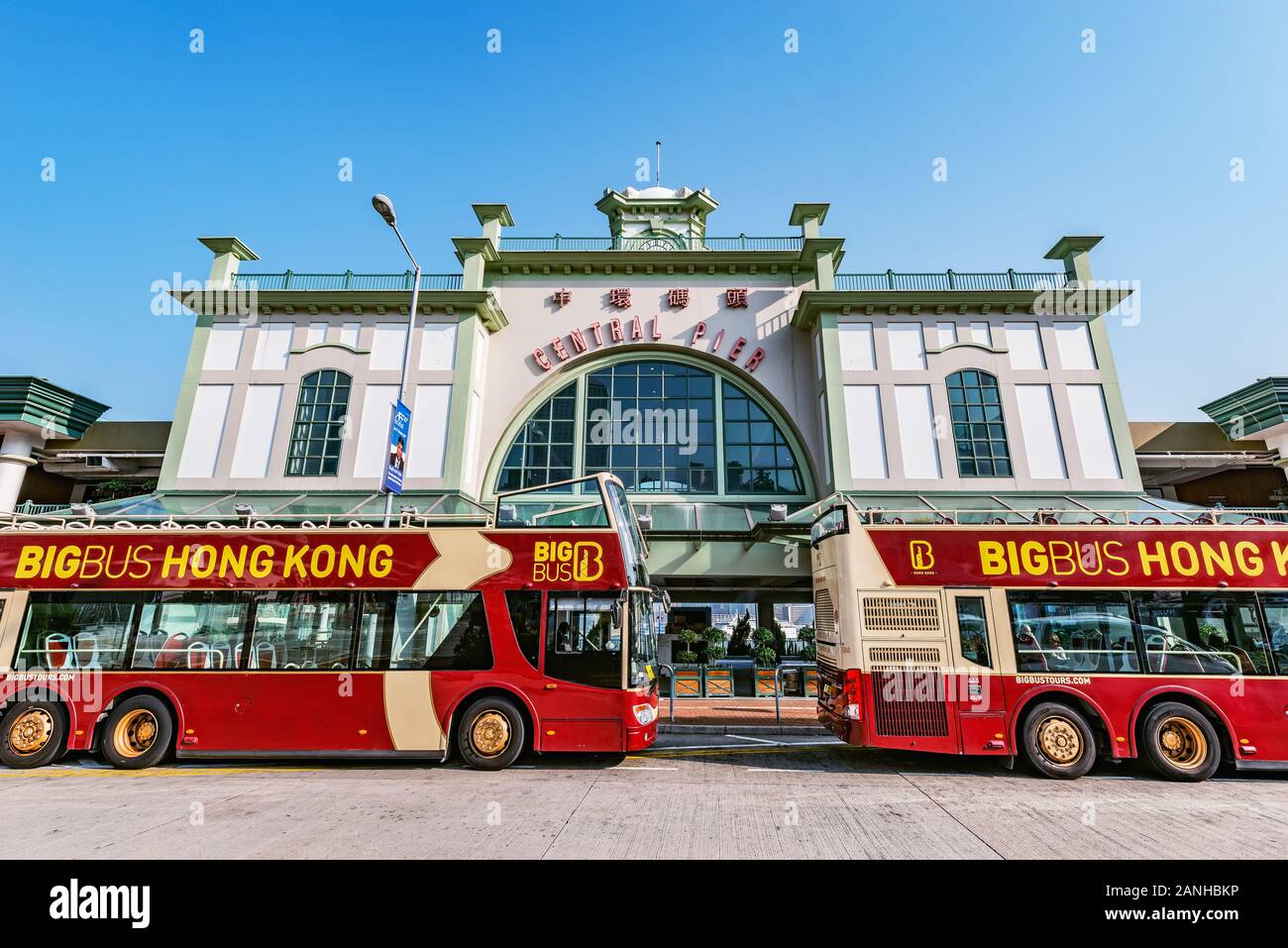 Double deck excursion buses stand by the Central pier. Stock Photo