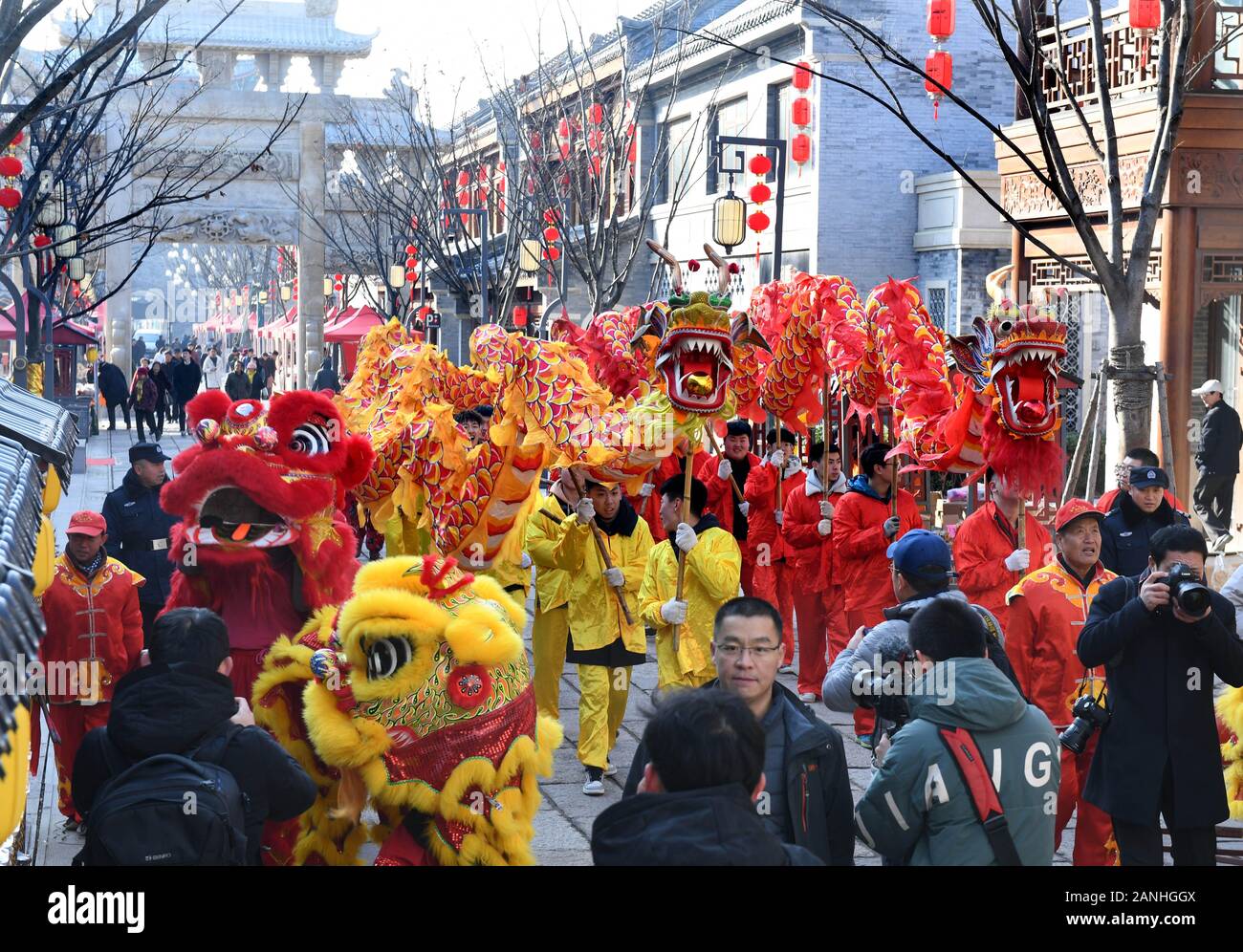 Qingdao, China's Shandong Province. 17th Jan, 2020. Actors perform dragon and lion dance during a cultural event in Qingdao, east China's Shandong Province, Jan. 17, 2020. The cultural event featuring handicrafts, snacks and folklore performances was held in Qingdao to greet the upcoming Chinese Spring Festival. Credit: Li Ziheng/Xinhua/Alamy Live News Stock Photo