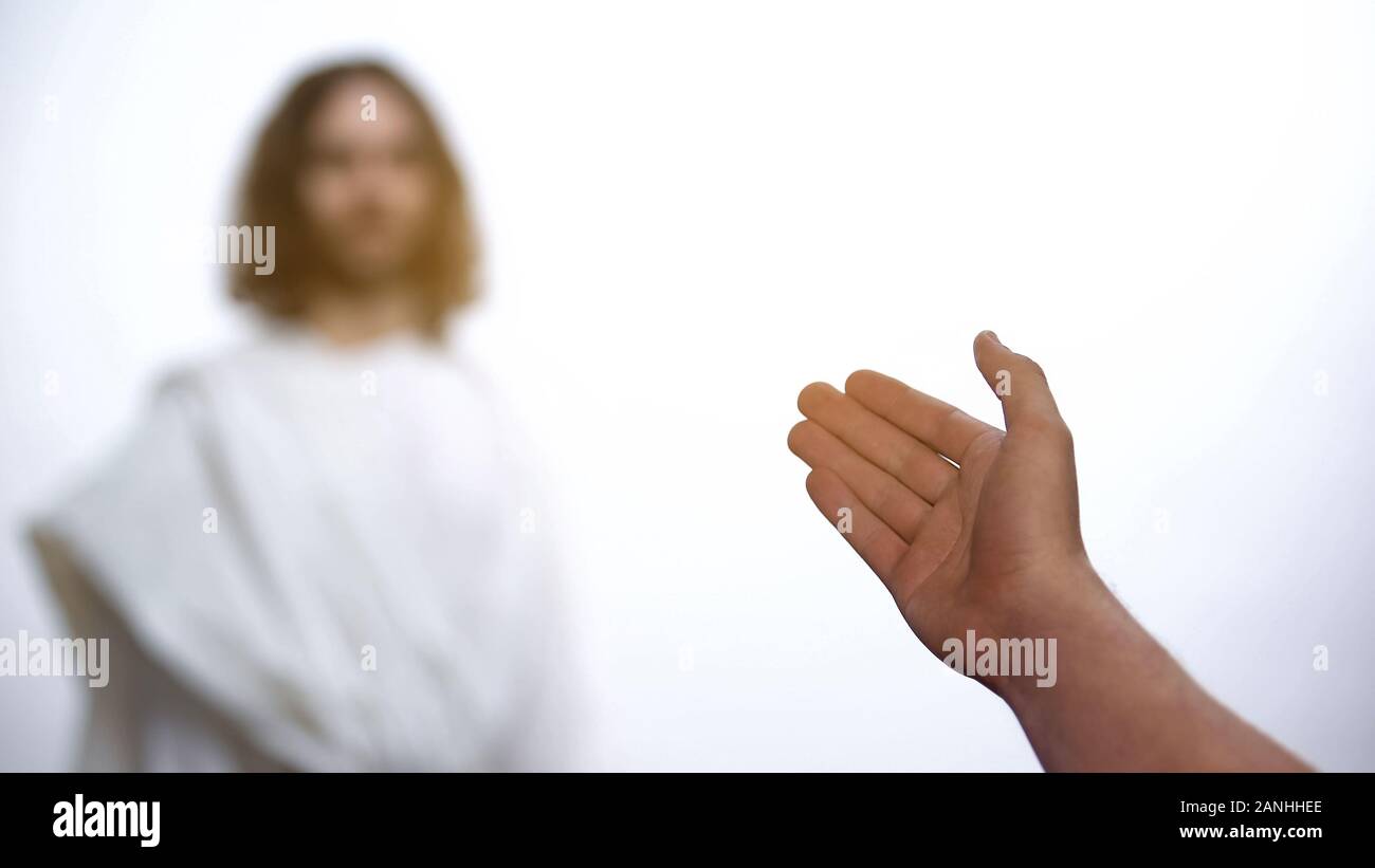 Father welcoming Jesus Christ to heaven, greeting son and giving helping hand Stock Photo