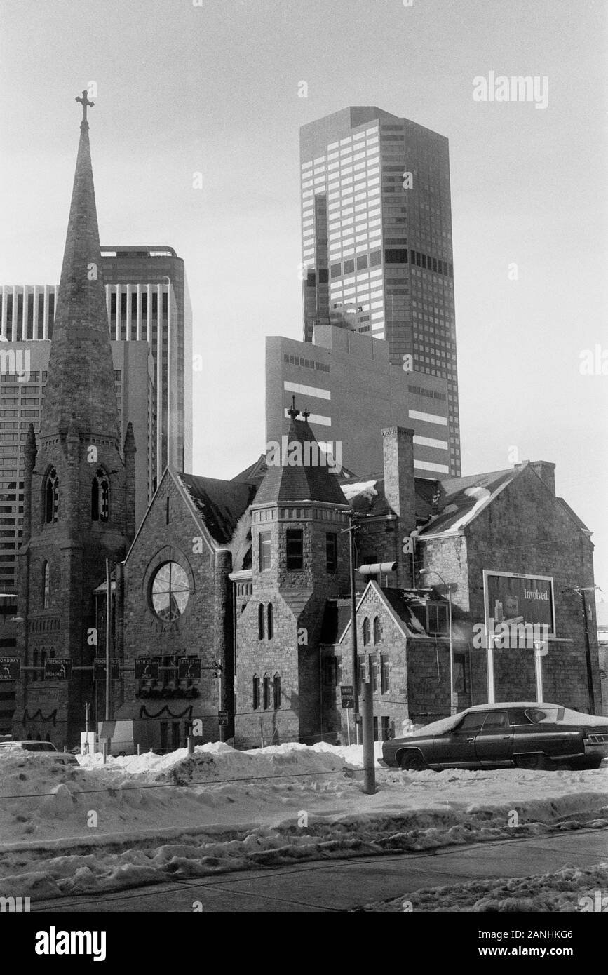 DENVER COLORADO IN WINTER SKYSCRAPERS AND A SMALL CHURCH IN PART OF THE CITY - US VINTAGE PHOTOGRAPHY ARCHIVE - SILVER FILM © Frédéric BEAUMONT Stock Photo
