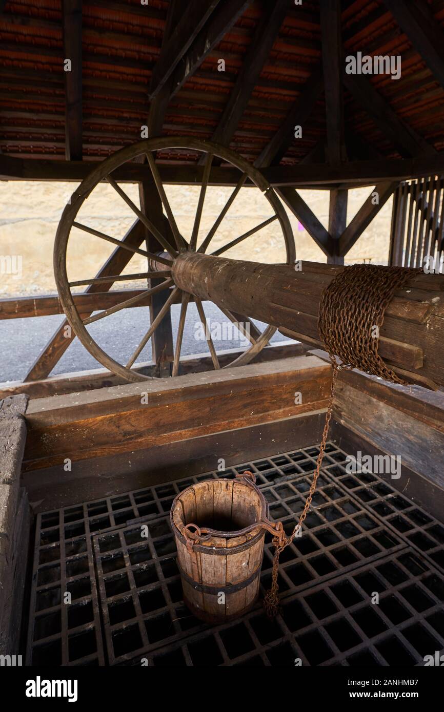 Wooden well with pulley and bucket Stock Photo Alamy