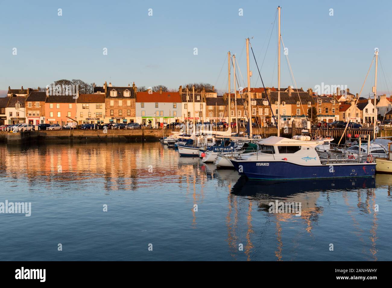Town of Anstruther, Scotland. Picturesque sunset view of leisure and fishing boats berthed at Anstruther Harbour. Stock Photo