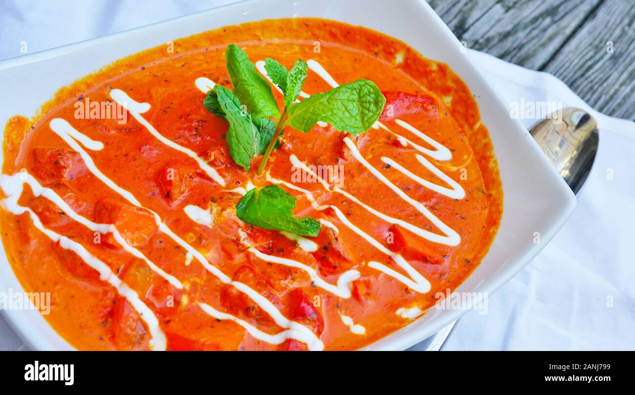 A Dish Of Butter Chicken Tikka Masala In Red Sauce At An Indian
