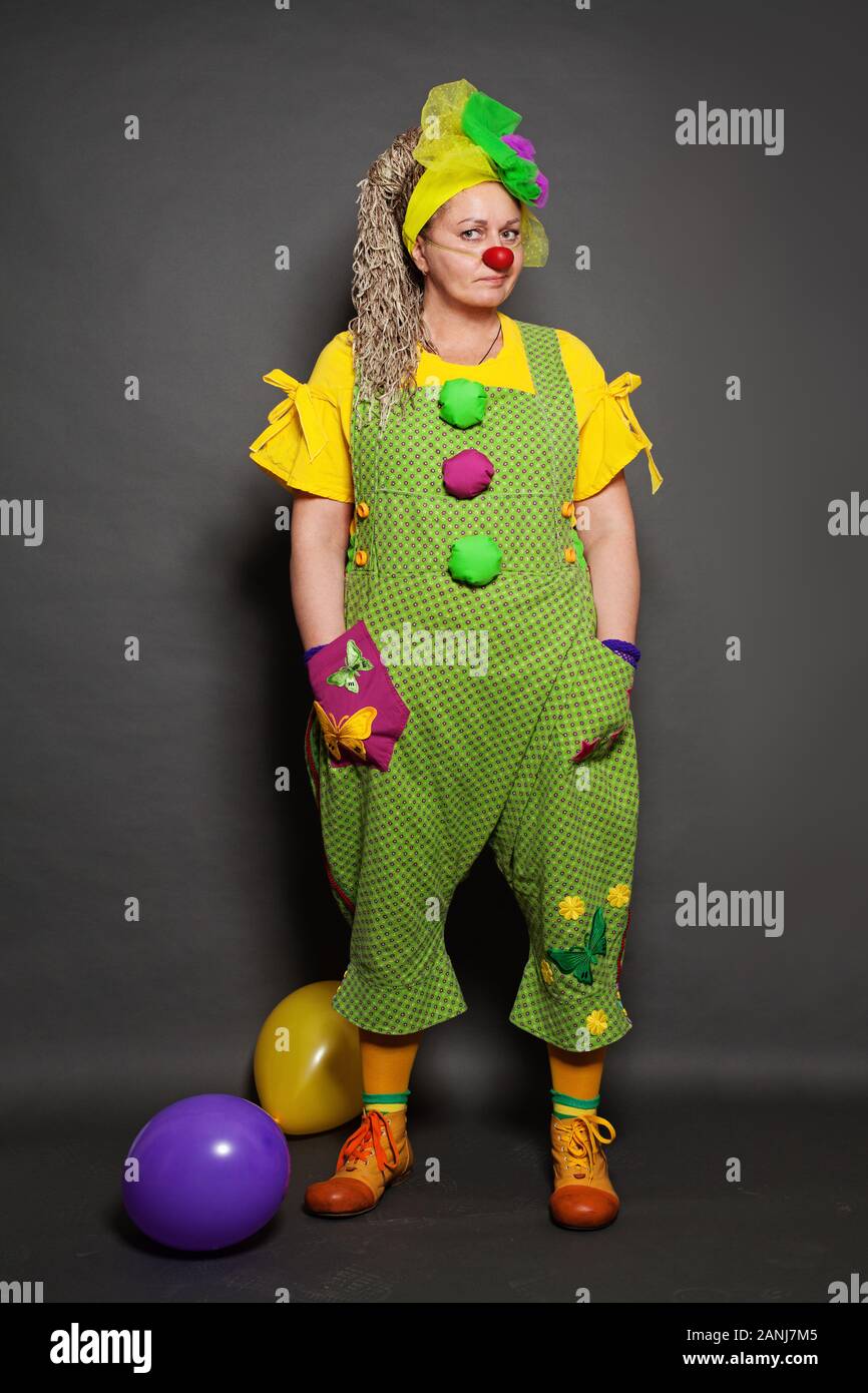 Performance Actress clown posing. Clown occupation Stock Photo