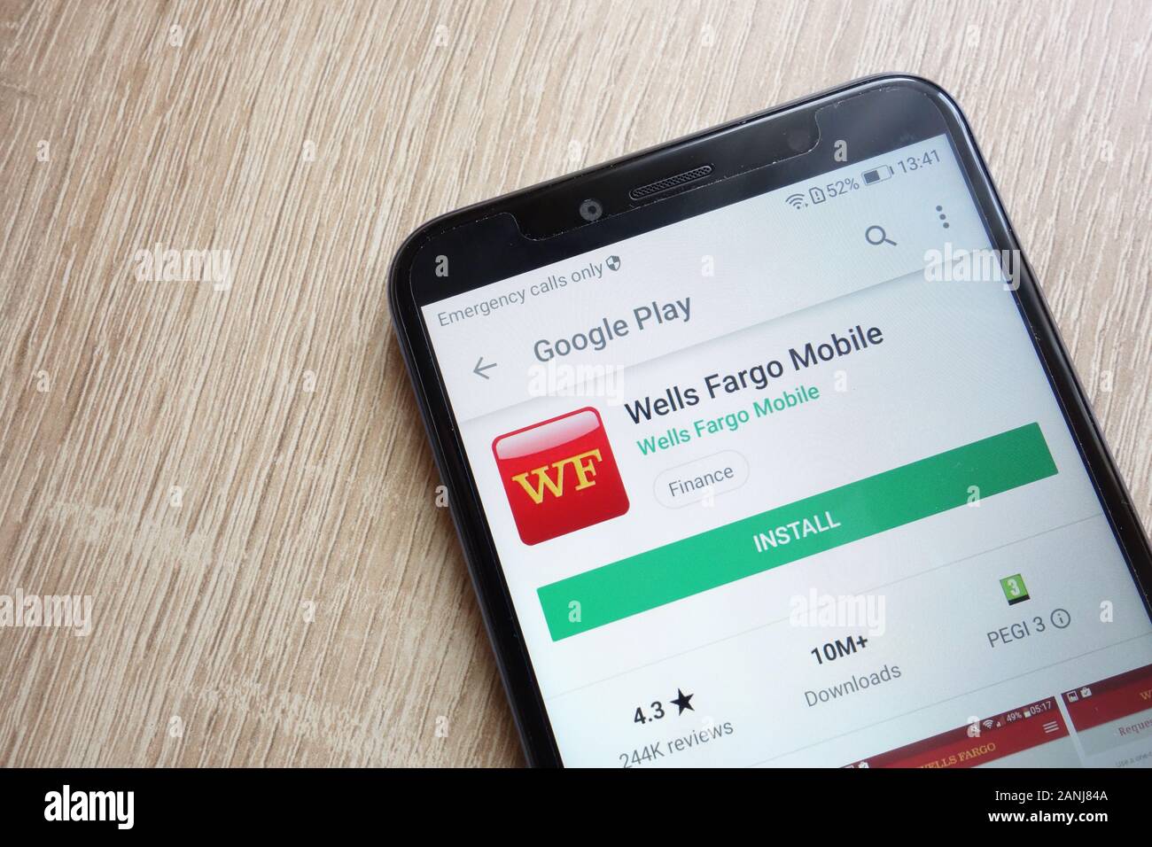 Wells Fargo Mobile app on Google Play Store website displayed on Huawei Y6 2018 smartphone Stock Photo