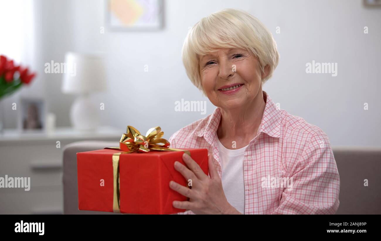Smiling Senior Female Holding Gift Box Happiness Womens Day Celebration Stock Photo Alamy