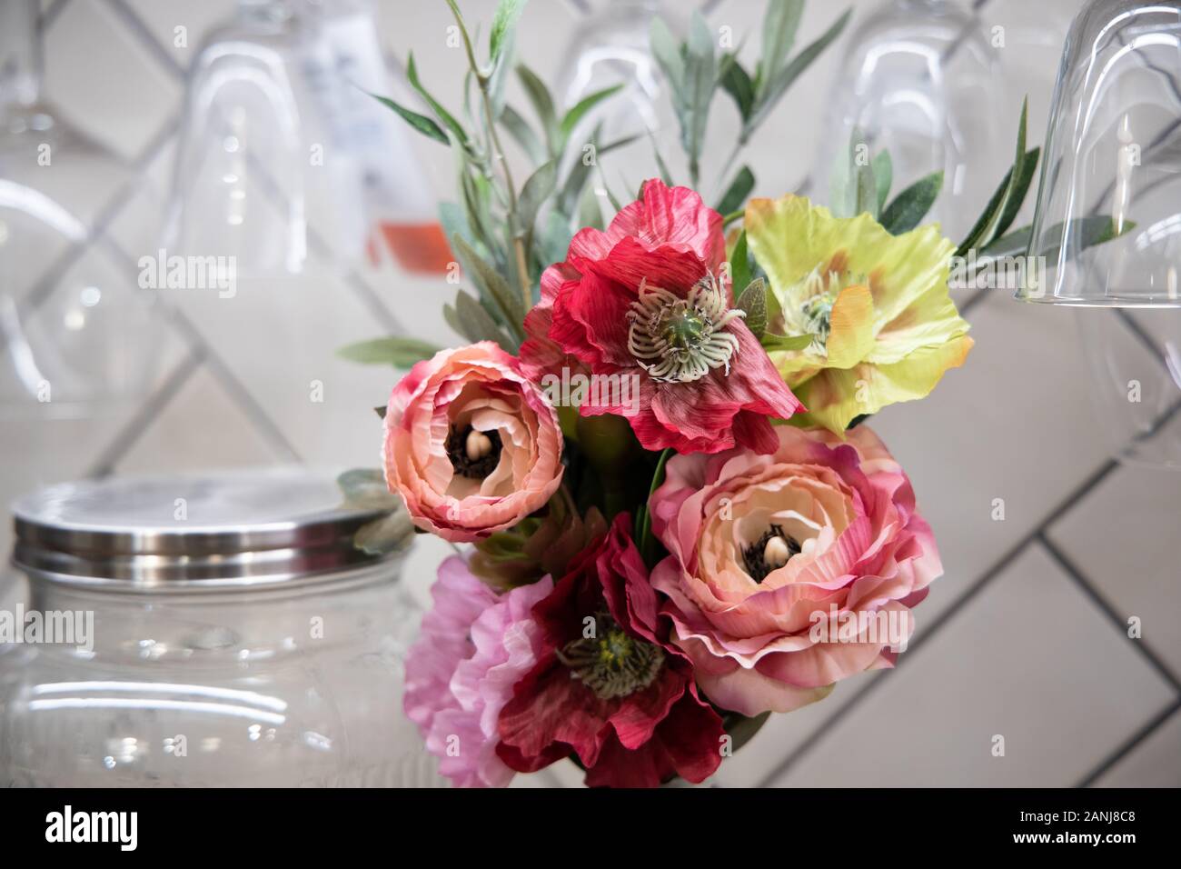 Bouquet from roses and other flowers on a table. Stock Photo