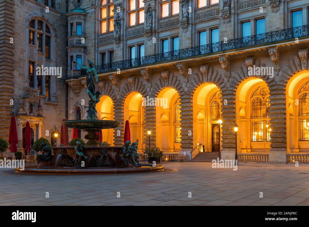 Fountain in the inner courtyard of the town hall at dusk, Hamburg, Germany, Europe Stock Photo
