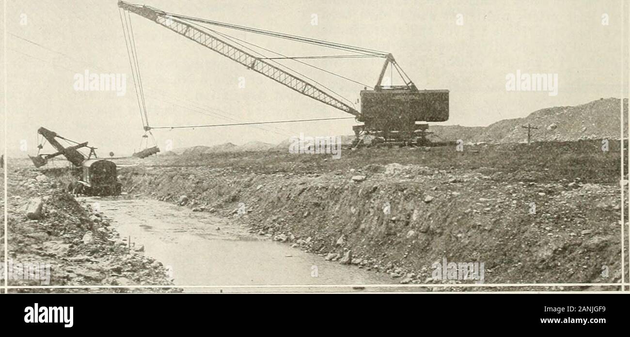 Engineering and Contracting . Fig. ii Drag-Line ExcavatO- l-iandling Spoil from a Steam Shovel. Calumet-Sag Canal. erful excavator. For the top excavation a drag-line ex-cavator was suitable, but it could not handle econom-ically the hard glacial drift. The scheme worked out wasto use for the top excavation a 235-ton Bucyrus drag-linewith a 3^2 cu. yd. bucket and a working radius, of 128I2ft., and for the glacial drift to use a 70-ton Bucyrusshovel. To handle the spoil from the shovel it was theidea to transform the drag-line excavator into a derrick,replacing the excavator bucket by a steel s Stock Photo