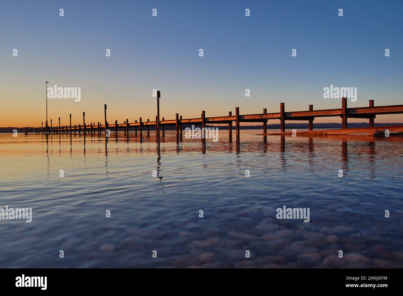 Ambach, Germany January 2020: Impressions Ambach - recreation area - January 2020 sunset in Ambach (Lkr.Bad Toelz/Wolfratshausen) on Lake Starnberg, recreation area and bathing area | usage worldwide Stock Photo