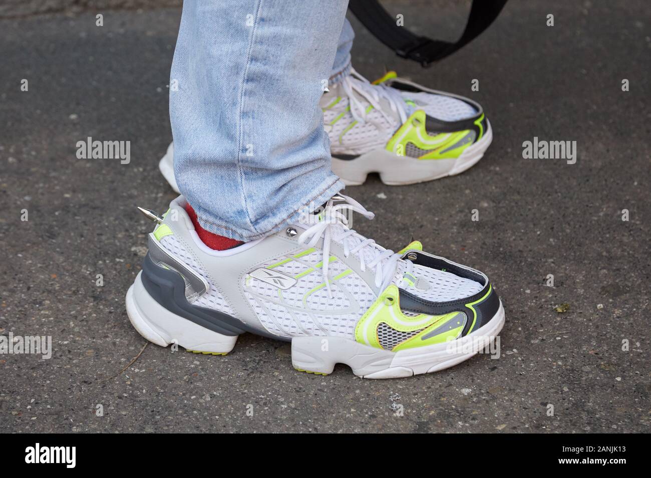 MILAN, ITALY - JANUARY 13, 2019: Man with white and yellow green Reebok  sneakers before Fendi fashion show, Milan Fashion Week street style Stock  Photo - Alamy