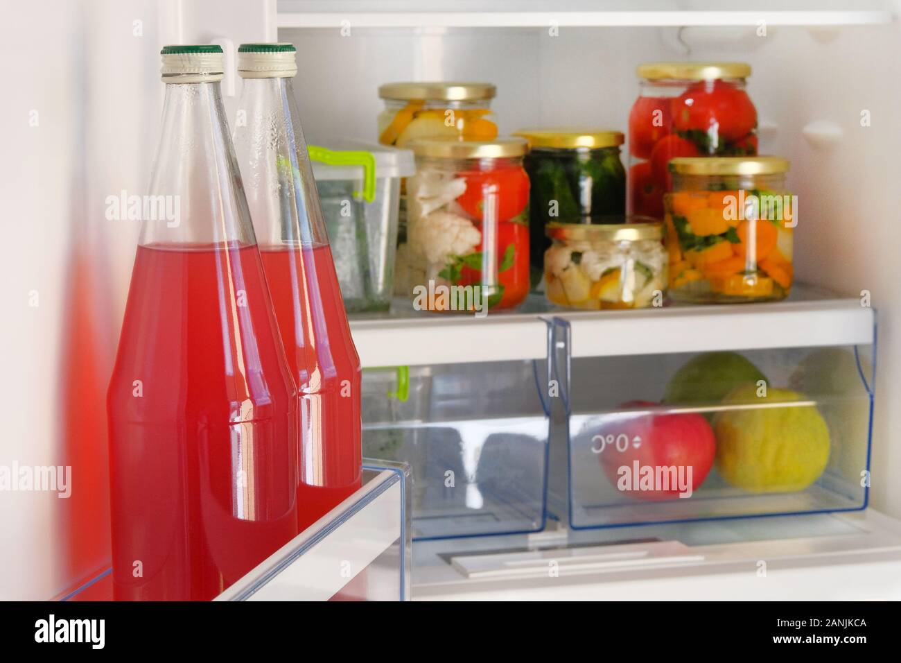 https://c8.alamy.com/comp/2ANJKCA/bottles-with-homemade-red-juice-and-jars-of-various-pickled-organic-vegetables-stand-in-fridge-fermented-healthy-natural-food-concept-2ANJKCA.jpg