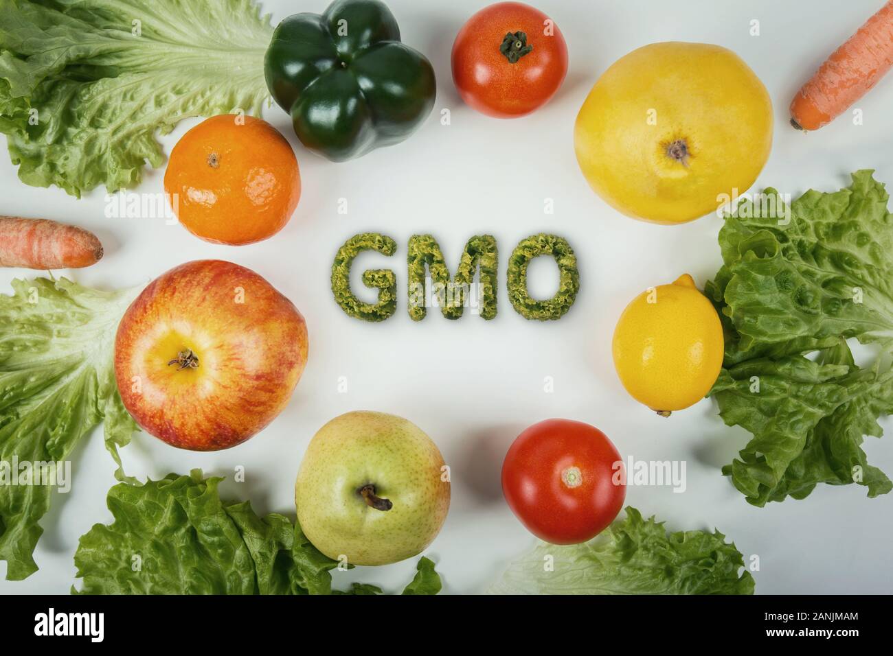 Top view different GMO fruits and vegetables arranged on the table. Non organic food dangerous nutrition for human health. Fresh crop genetically modi Stock Photo