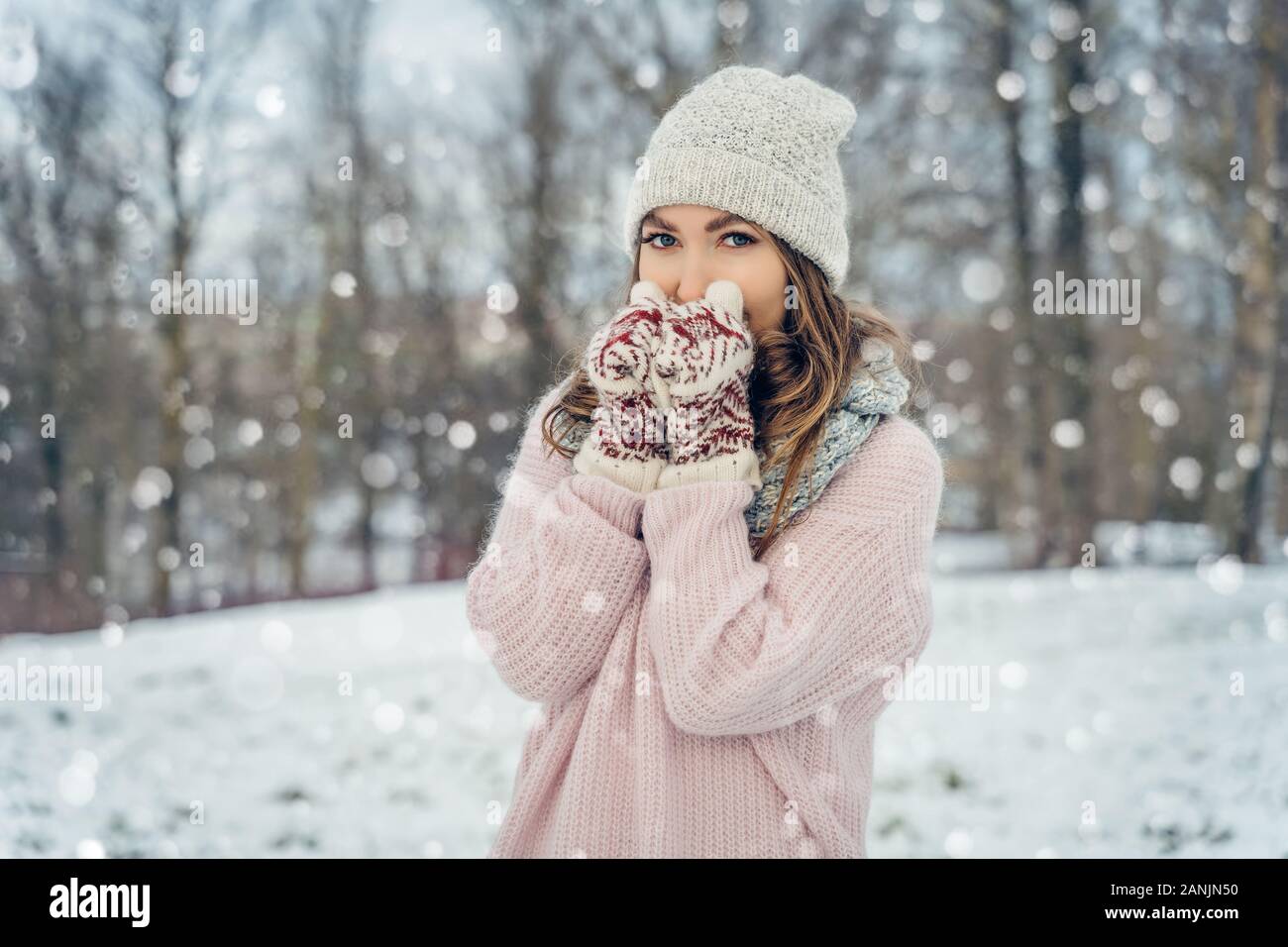 Winter young woman portrait. Beauty Joyful Model Girl laughing and having fun in winter park. Beautiful young female outdoors, Enjoying nature Stock Photo