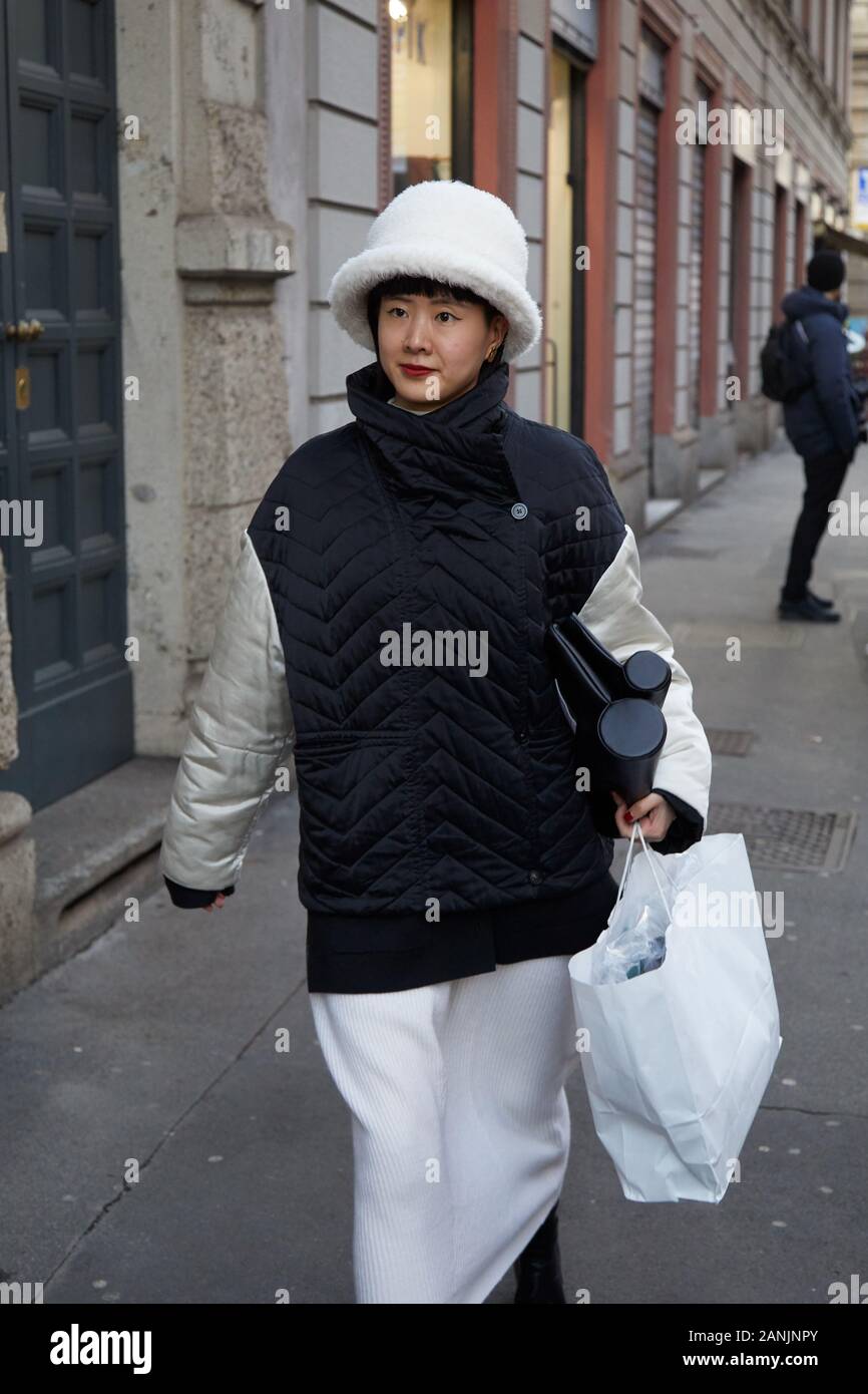 MILAN, ITALY - JANUARY 13, 2019: Woman with Louis Vuitton gray jacket with  logo relief before Reshake fashion show, Milan Fashion Week street style  Stock Photo - Alamy