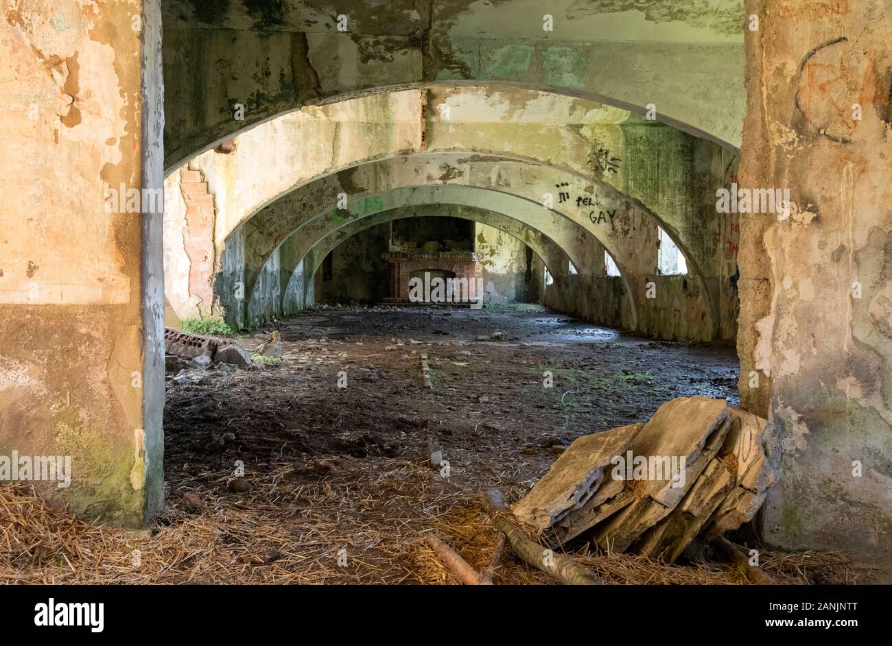 Interior of the abandoned bunkhouse of the never-completed Santander-Mediterráneo railway line (Yera, Vega de Pas, Valles Pasiegos, Cantabria, Spain) Stock Photo