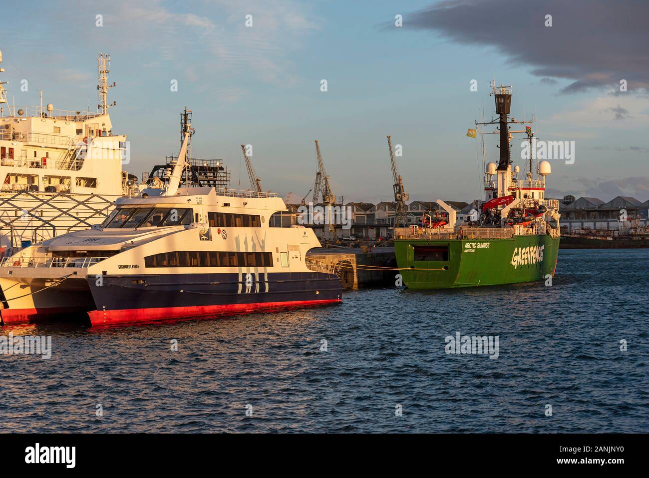 Cape Town South Africa. December 2019. The Greenpeace vessel Artic Sunrise & Robin Island ferry, Sikhululekile in Cape Town harbour. Stock Photo