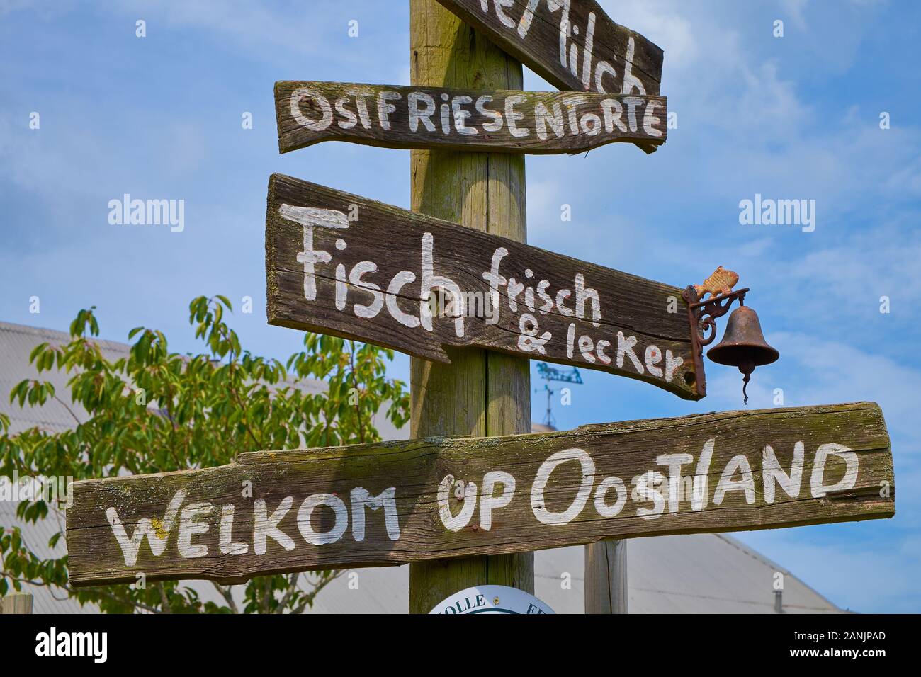 Wooden welcome and product signs of Café Ostland a restaurant / eatery in the village of Ostland on Borkum island Stock Photo