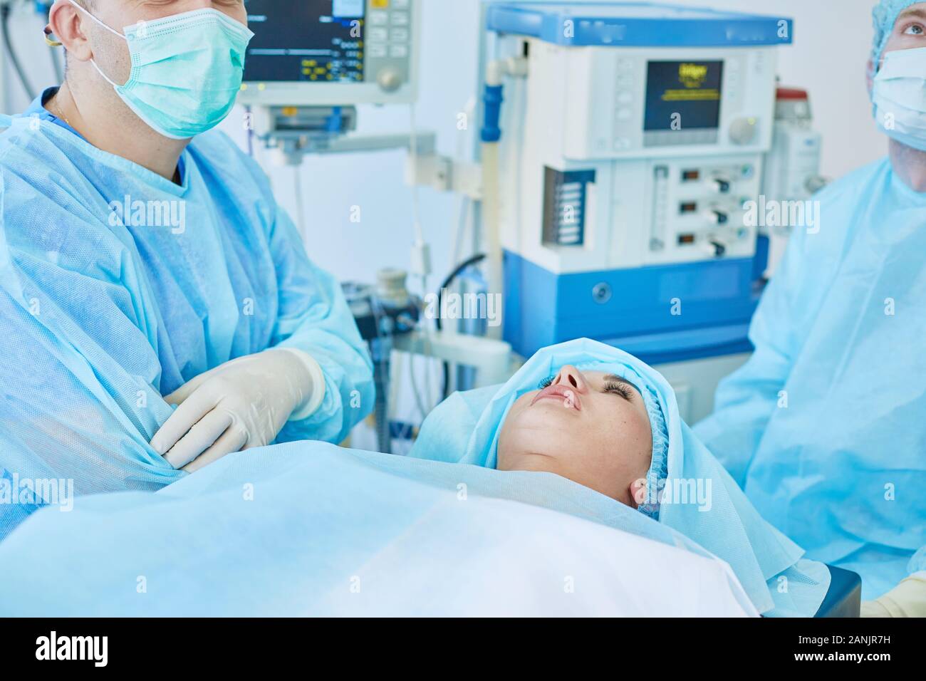 Several Doctors Surrounding Patient On Operation Table During Their Work Team Surgeons At Work