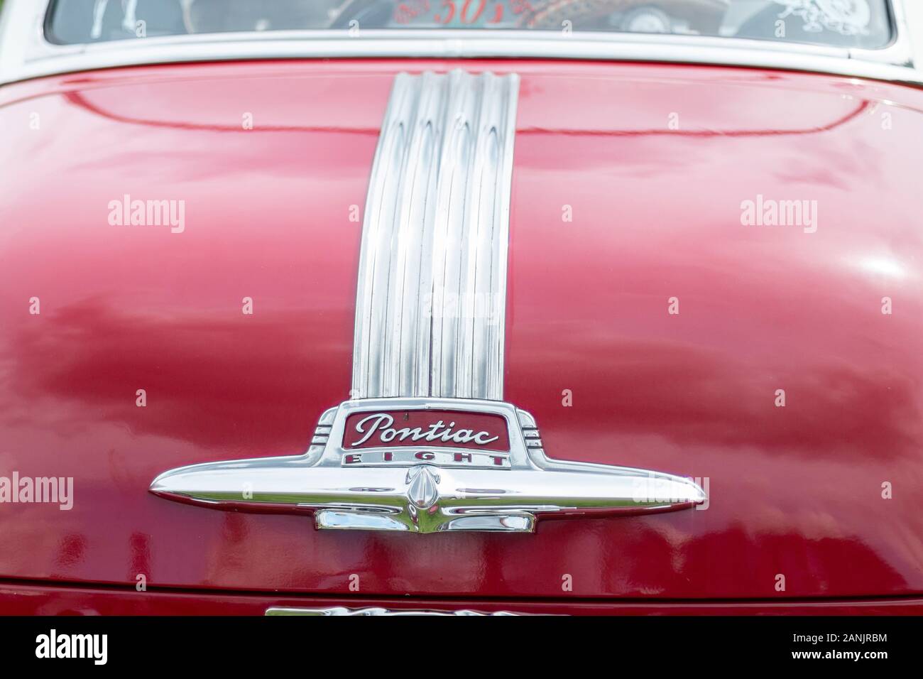detail of 1950s Pontiac Eight chrome trunk badge Stock Photo