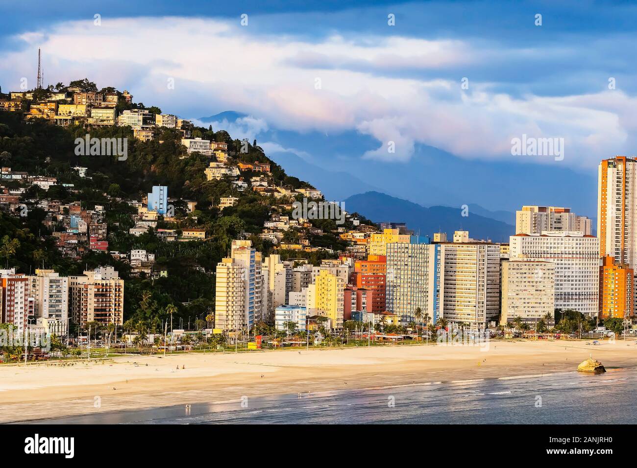Aerial view of a Brazilian coastal city of the Paulista coast. View of the beachfront city, some hills, and the Praia do Itarare beach. Sao Vicente SP Stock Photo