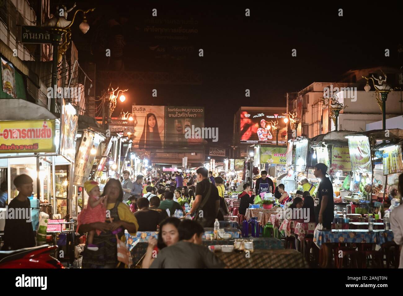Khon Kaen, THAILAND - January 2020: Local people sell and eating at street food traditional Thai food and drinks at night market in Khon Kaen Stock Photo
