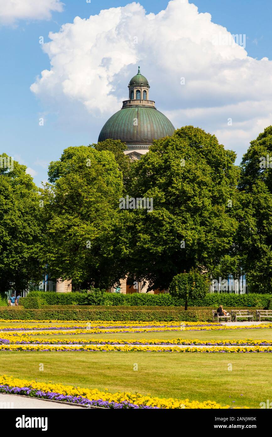 The dome of the Bayerische Staatskanziei building, behind trees, Englischer Garten, Munich, Bavaria, Germany Stock Photo