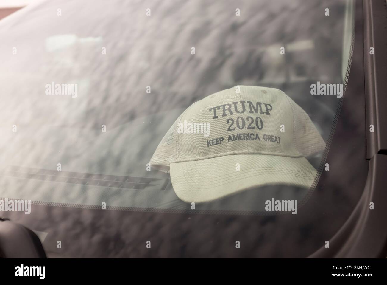 A baseball cap with Trump 2020 Keep America Great on it is seen behind the windscreen of a vehicle outside Atlanta, Geogia, USA Stock Photo