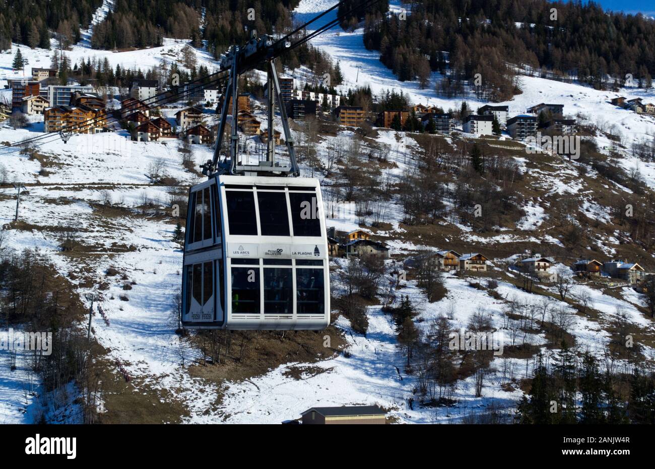 Cable car of the Vanoise Express travelling from Peisey Vallandry in Les Arcs  towards the La Plagne side. Stock Photo