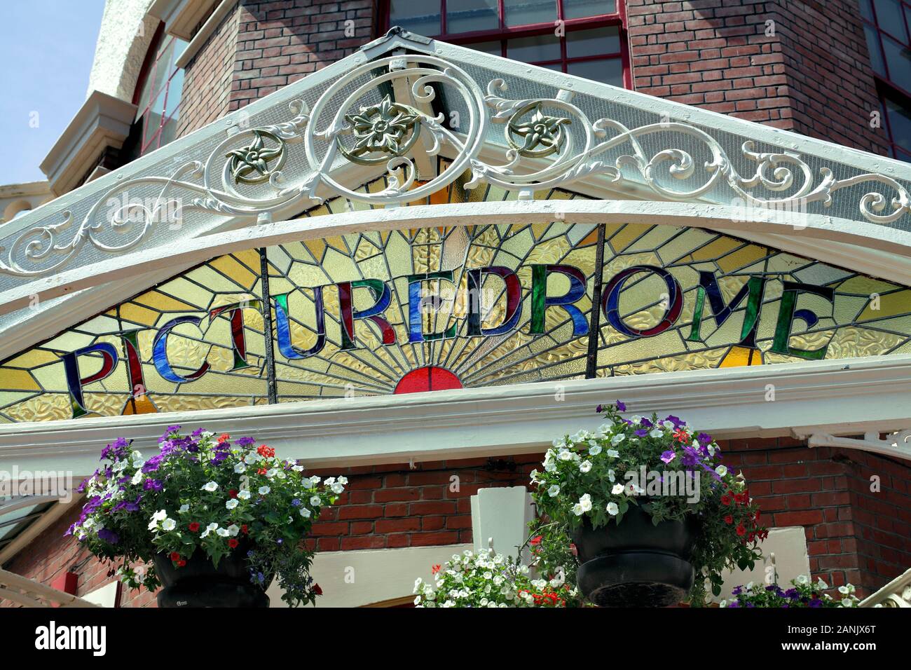 Close up of the canopy over the front entrance to the Picturedrome cinema in Bognor Regis, showing a rising sun motif behind ornate ironwork. Stock Photo